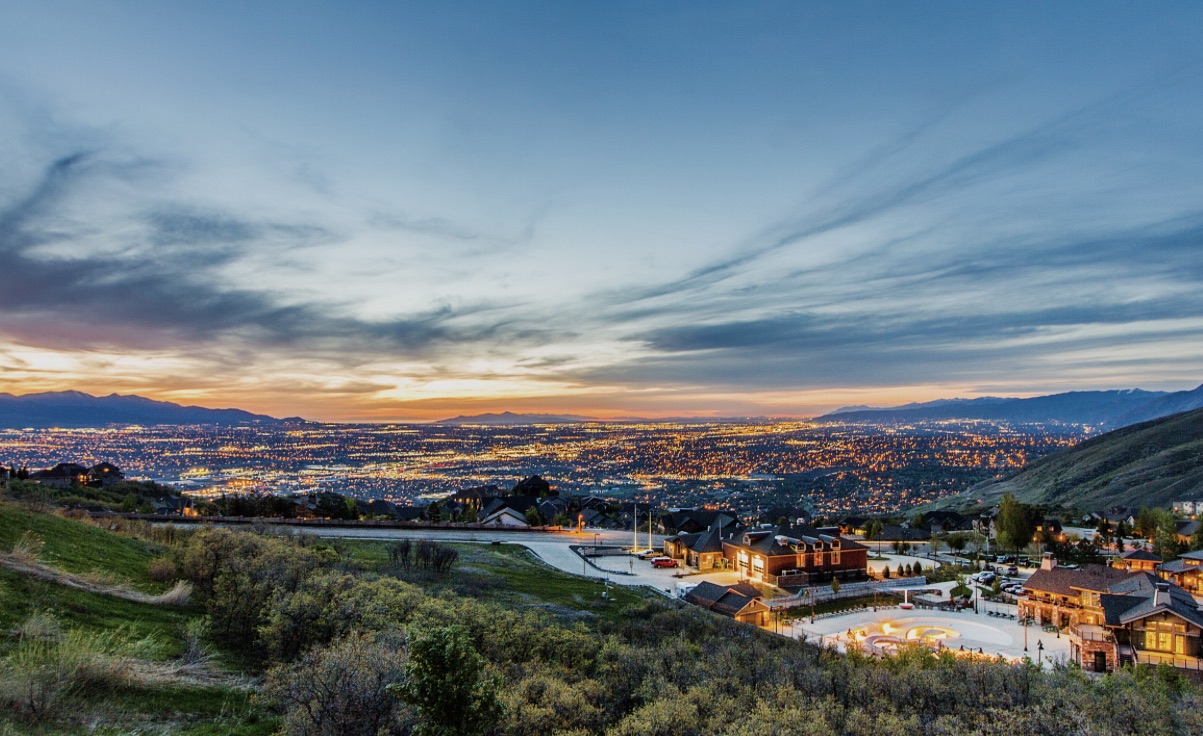 A Utah home with the Wasatch mountains behind it